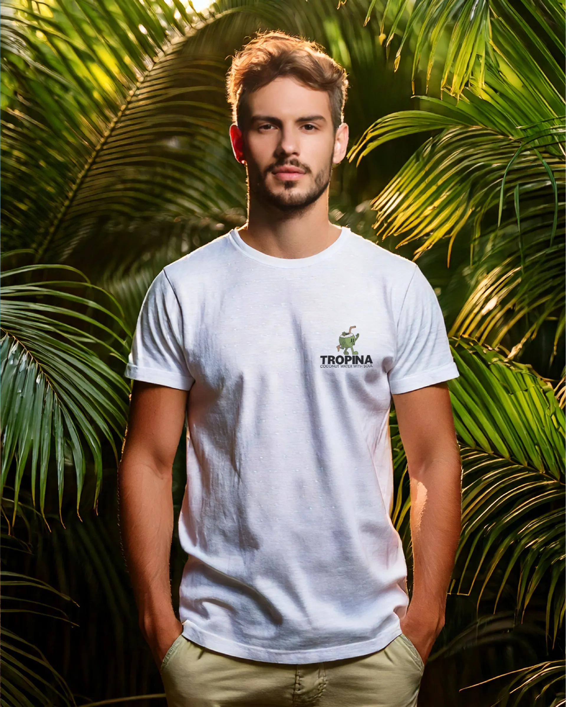 Concept mockup: a man in a white T-shirt with a small Tropina logo, in a tropical setting (Adobe Firefly scene)