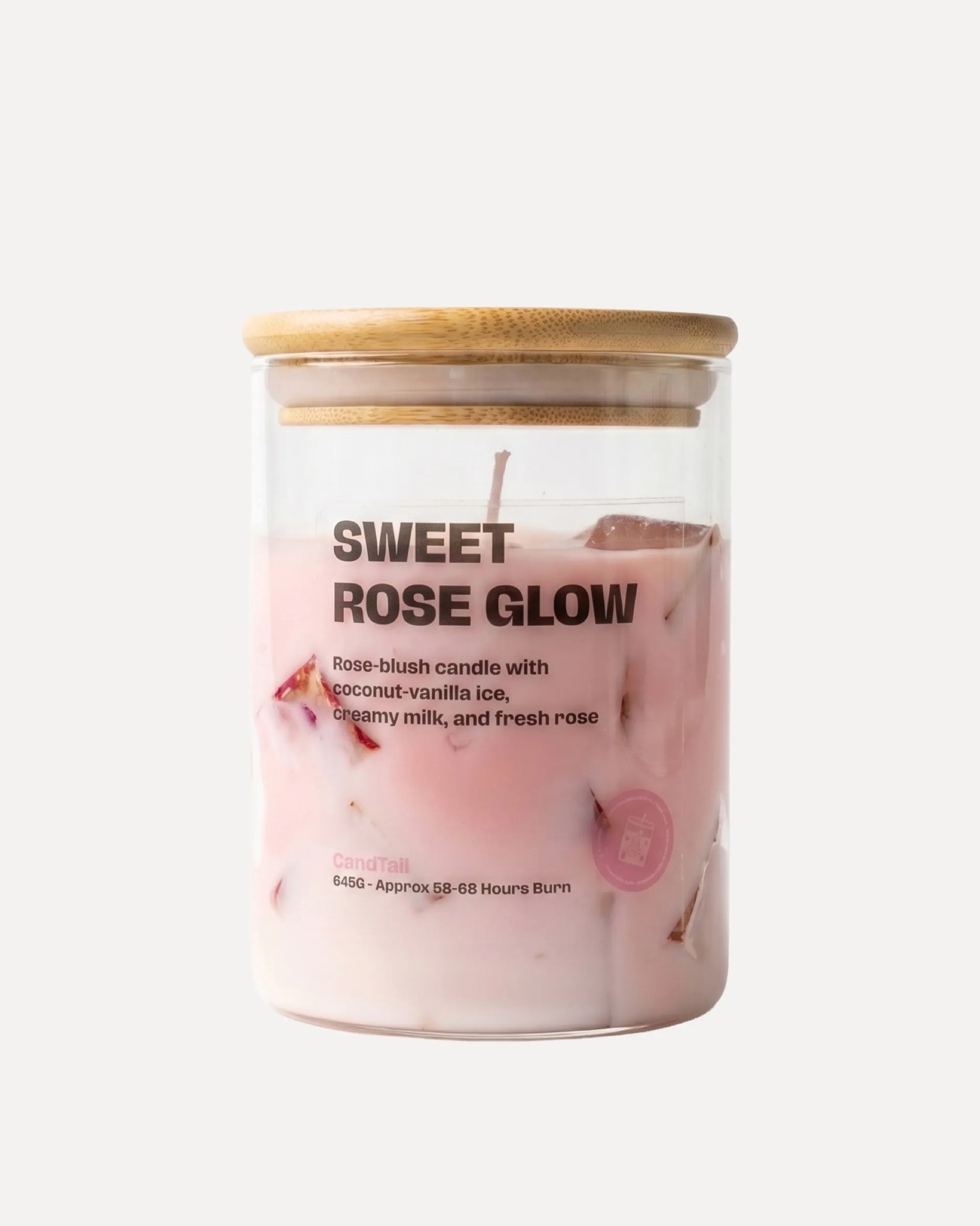 Sweet Rose Glow candle in a glass jar with a bamboo lid